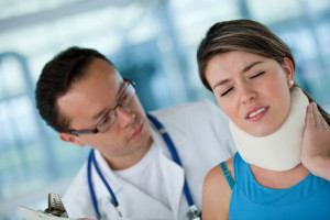 Injured woman with a physiotherapist